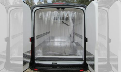 Ford Transit refrigerated van with strip curtain in rear door.