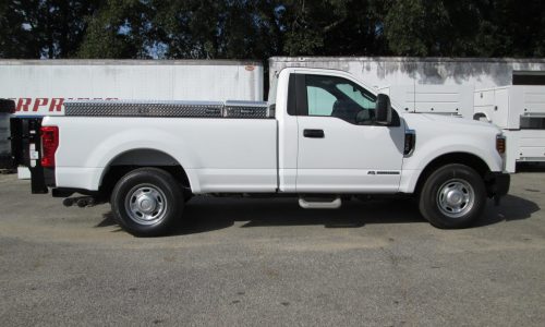 Ford F250 light duty service truck with liftgate and tool boxes.