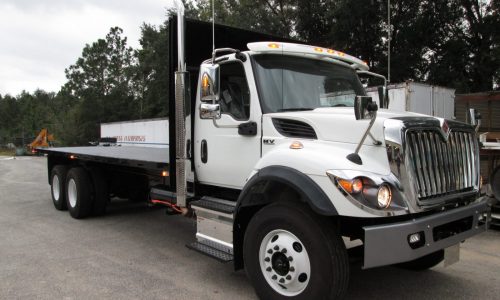 International truck with 26-foot custom flatbed for lumberyard.