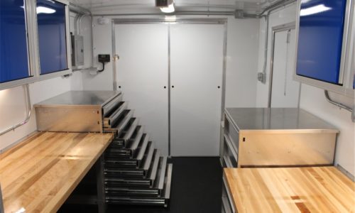 USCG trailer interior, forward view, with equipment trays pulled out on EZ Stak cabinet.