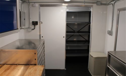 USCG trailer interior view, facing forward storage closet.