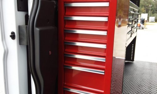 Six-drawer tool cabinet fits just inside sliding cargo door.