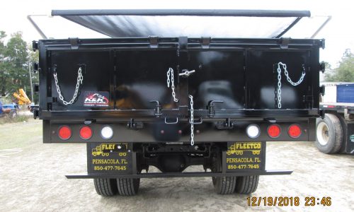 The custom tailgate can be operated as a traditional dump or opened as barn doors.