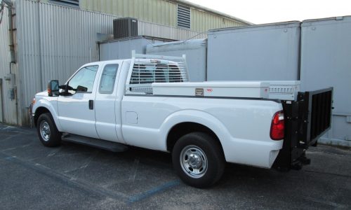 Ford F250 with RKI tool boxes, headache rack and liftgate.