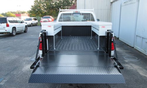 Ford F250 with RKI side boxes and Tommy Gate G2 liftgate, rear view.