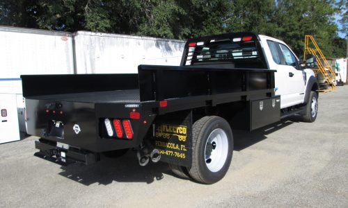 PJ flatbed with side panels and 48-inch underbody tool boxes.