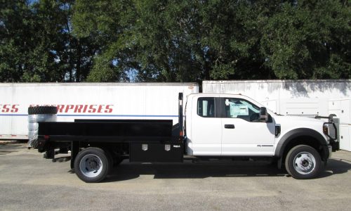 Ford F550 with PJ Truck Beds GB 11-foot flatbed with custom removable side panels.