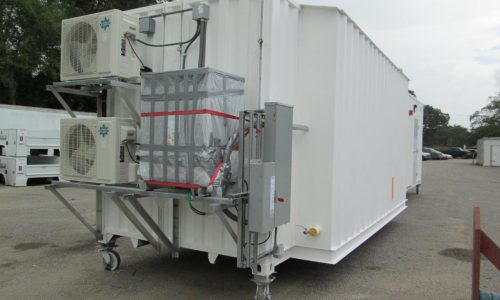 Modified container with HVAC, transformer and electrical panels.