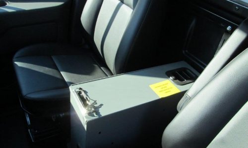 Lockable file box with writing surface in cab.